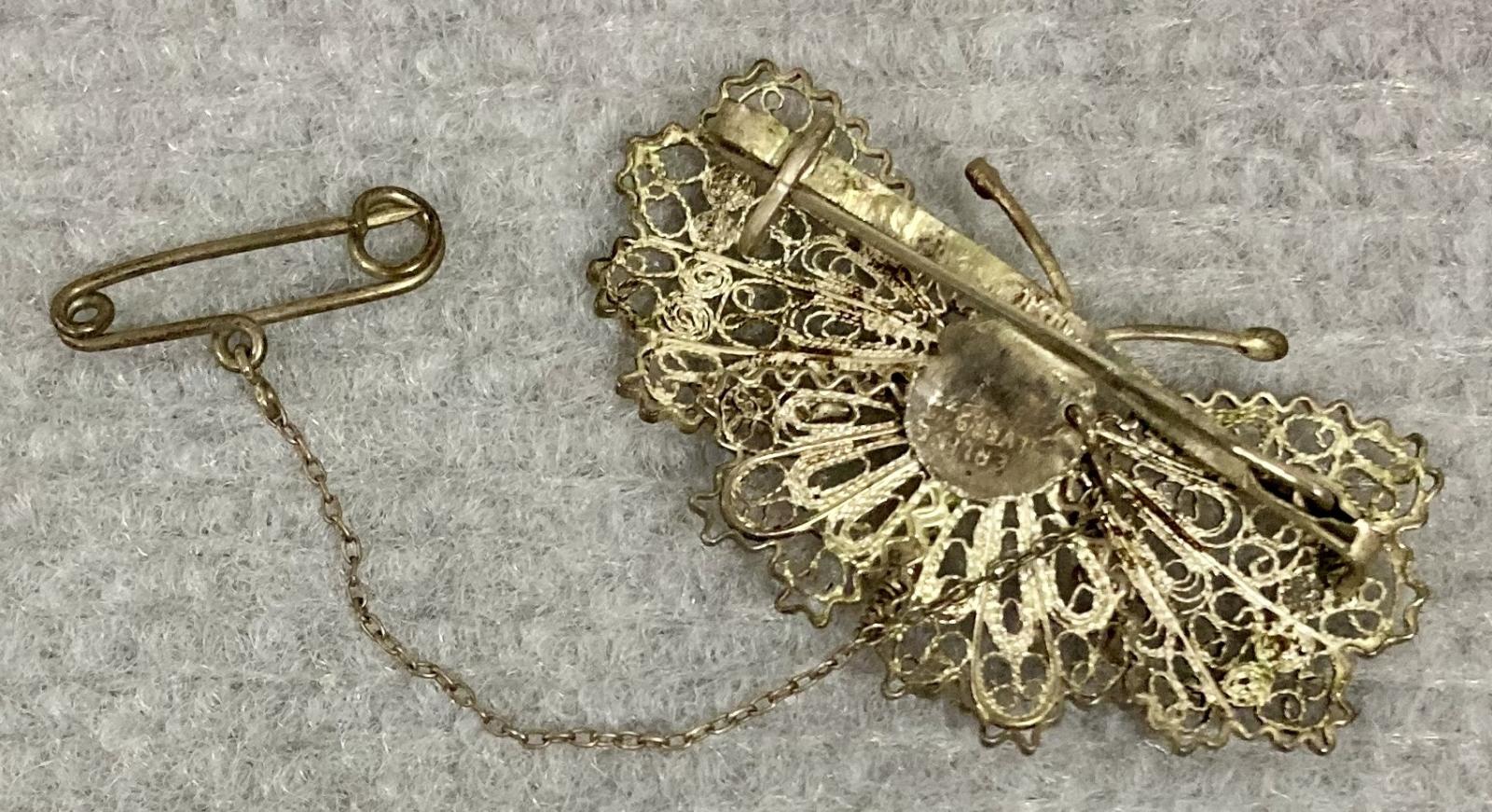 Reverse of silver filagree butterfly brooch sent from Evelyn to Dos from Palestine in 1942