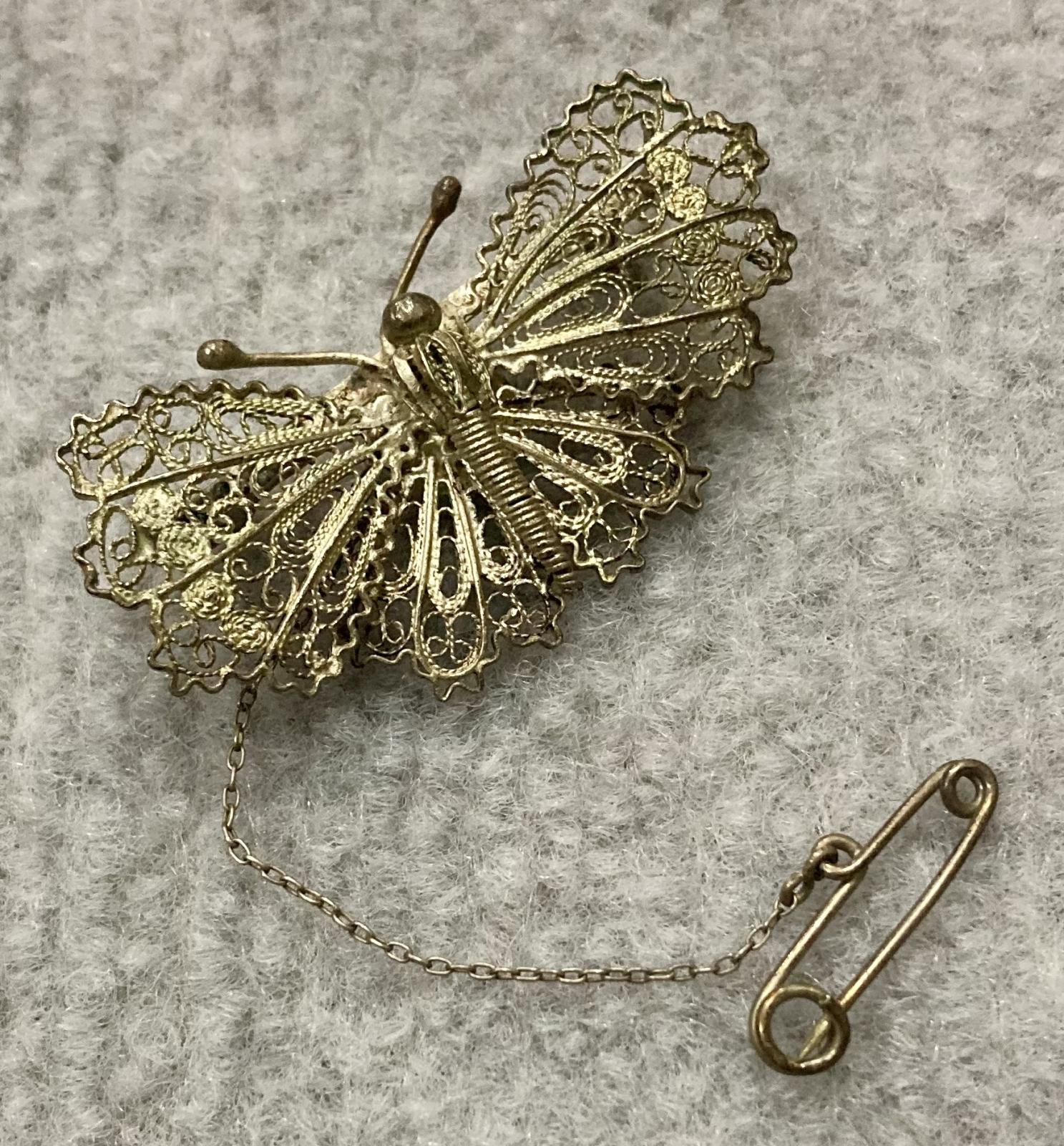 Silver filagree butterfly brooch sent from Evelyn to Dos from Palestine in 1942