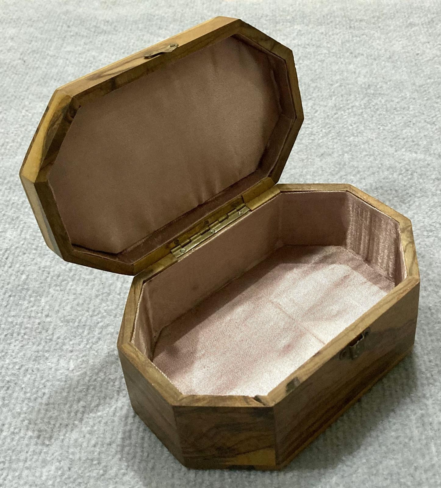 Oblique view of open souvenir olive wood jewellery box from Jerusalem