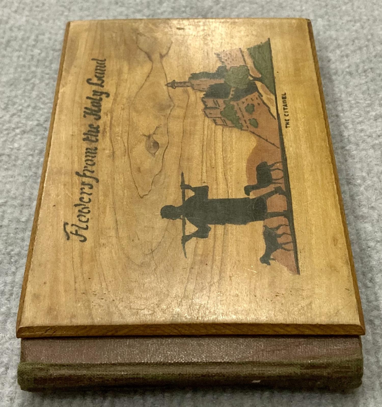 End view of front of souvenir olive wood album 