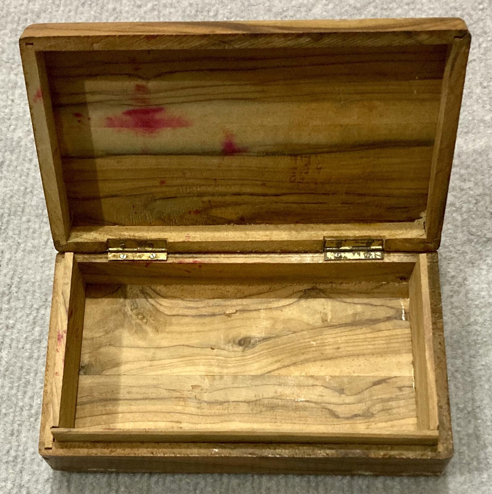 Inside of open souvenir olive wood box from Jerusalem