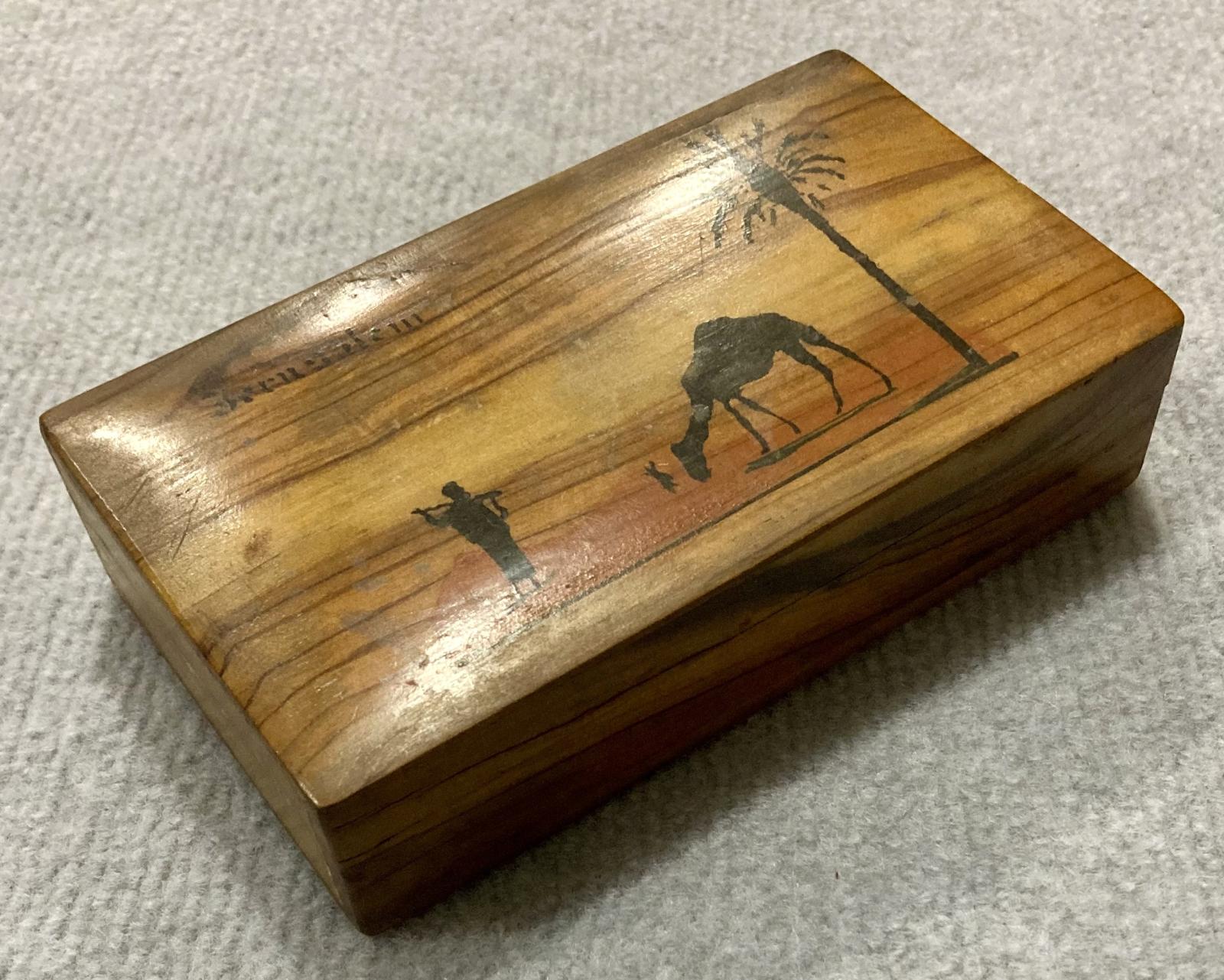 Oblique view of front of souvenir olive wood box from Jerusalem