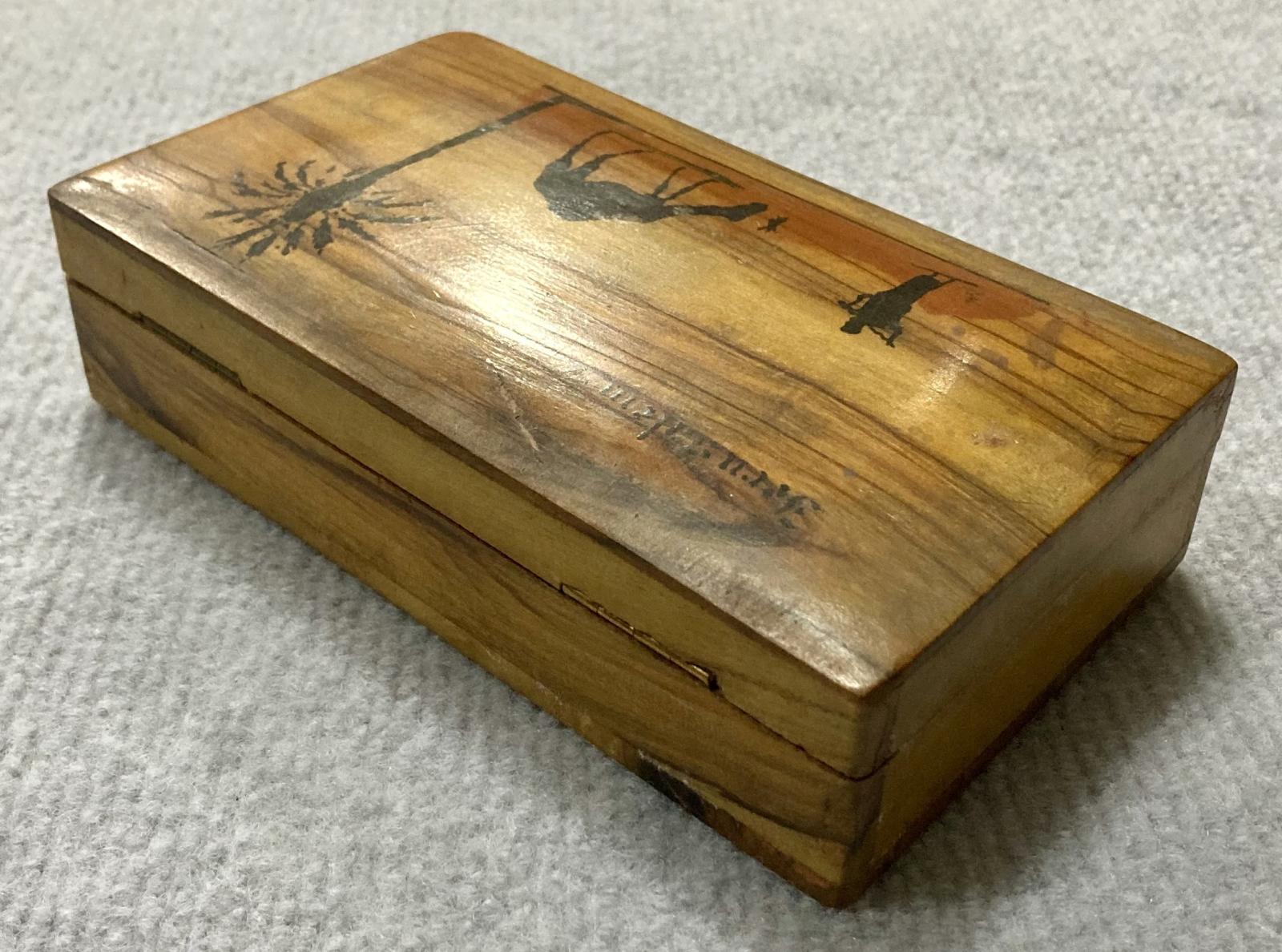 Oblique view of back of souvenir olive wood box from Jerusalem