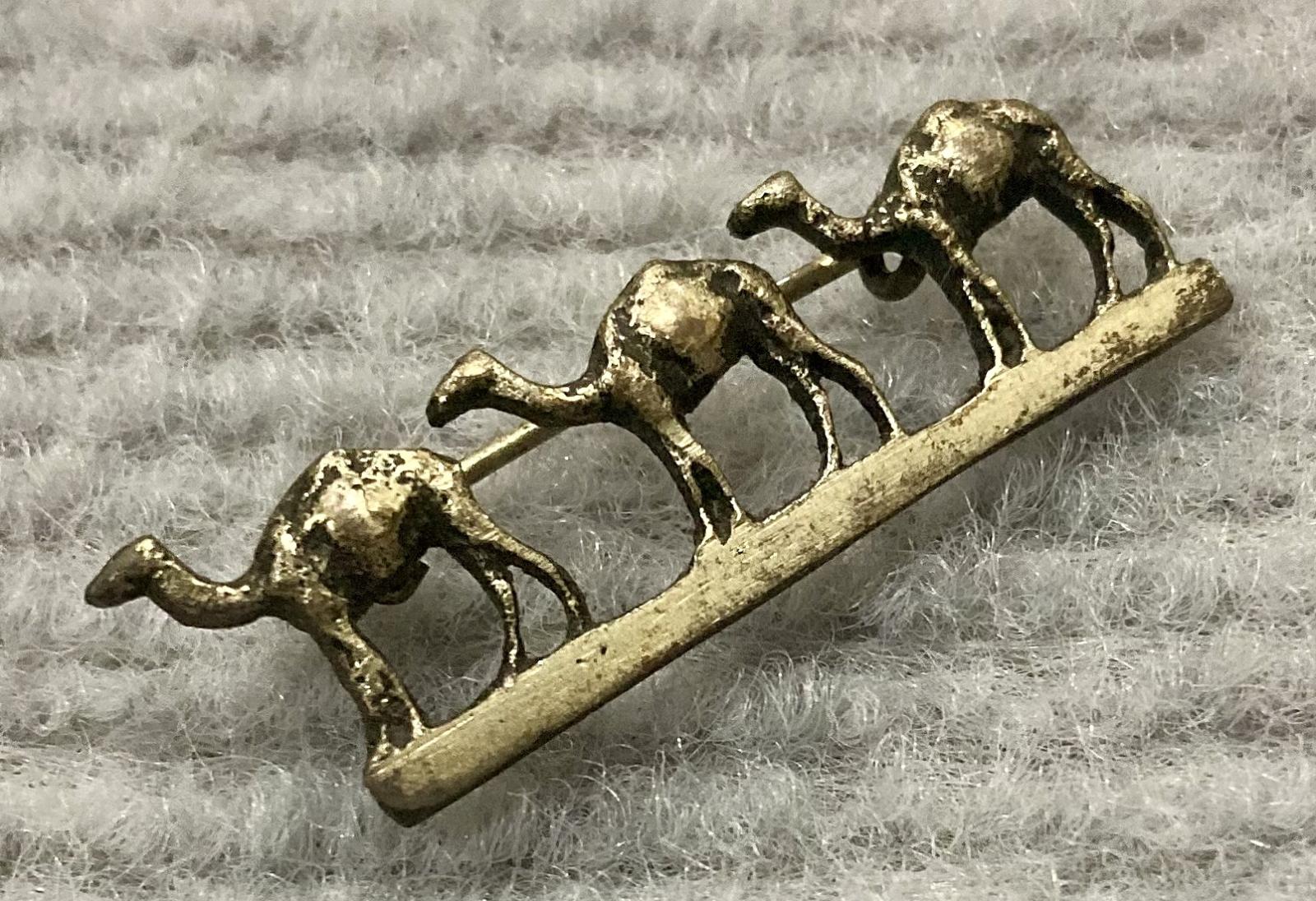 Oblique view of metal camel brooch sent from Jerusalem by Stanley Richard Steele
