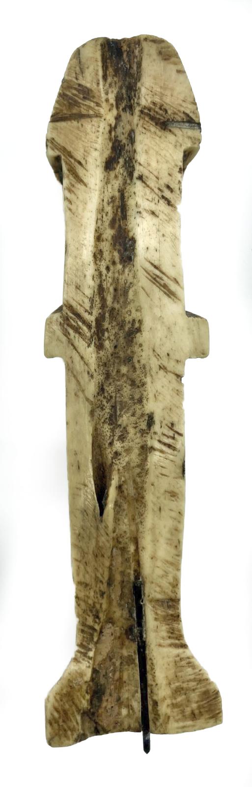 Reverse of carved camel bone in the form of an Egyptian shabti