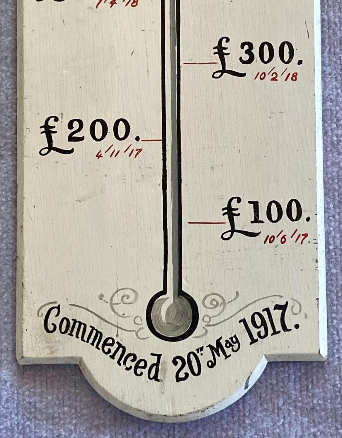 Close up of bottom section of painted timber War Savings Group plaque