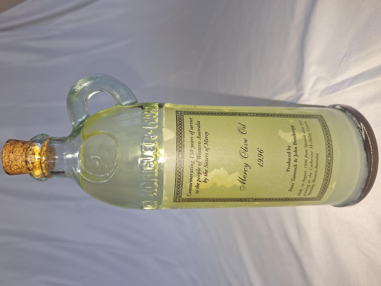 25-202 Mercy olive oil 1996 with background image