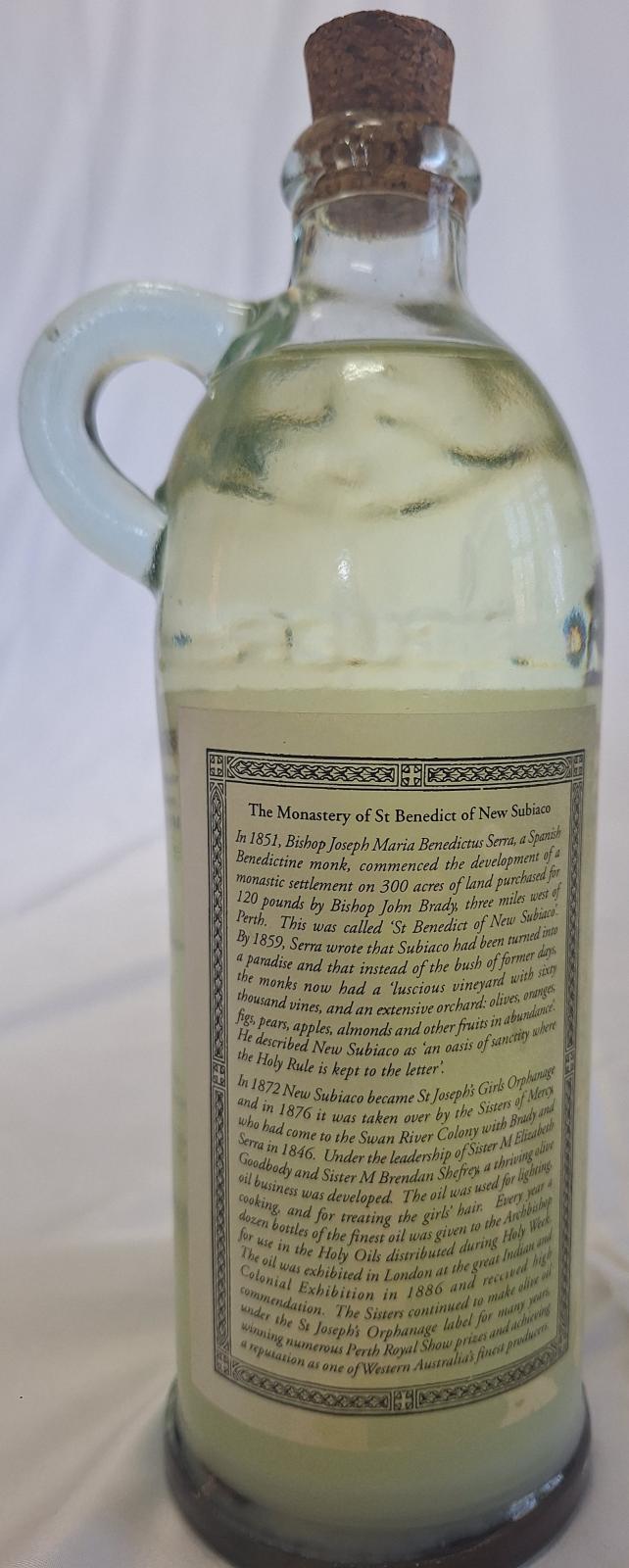 25-202 Mercy olive oil 1996 with background image back