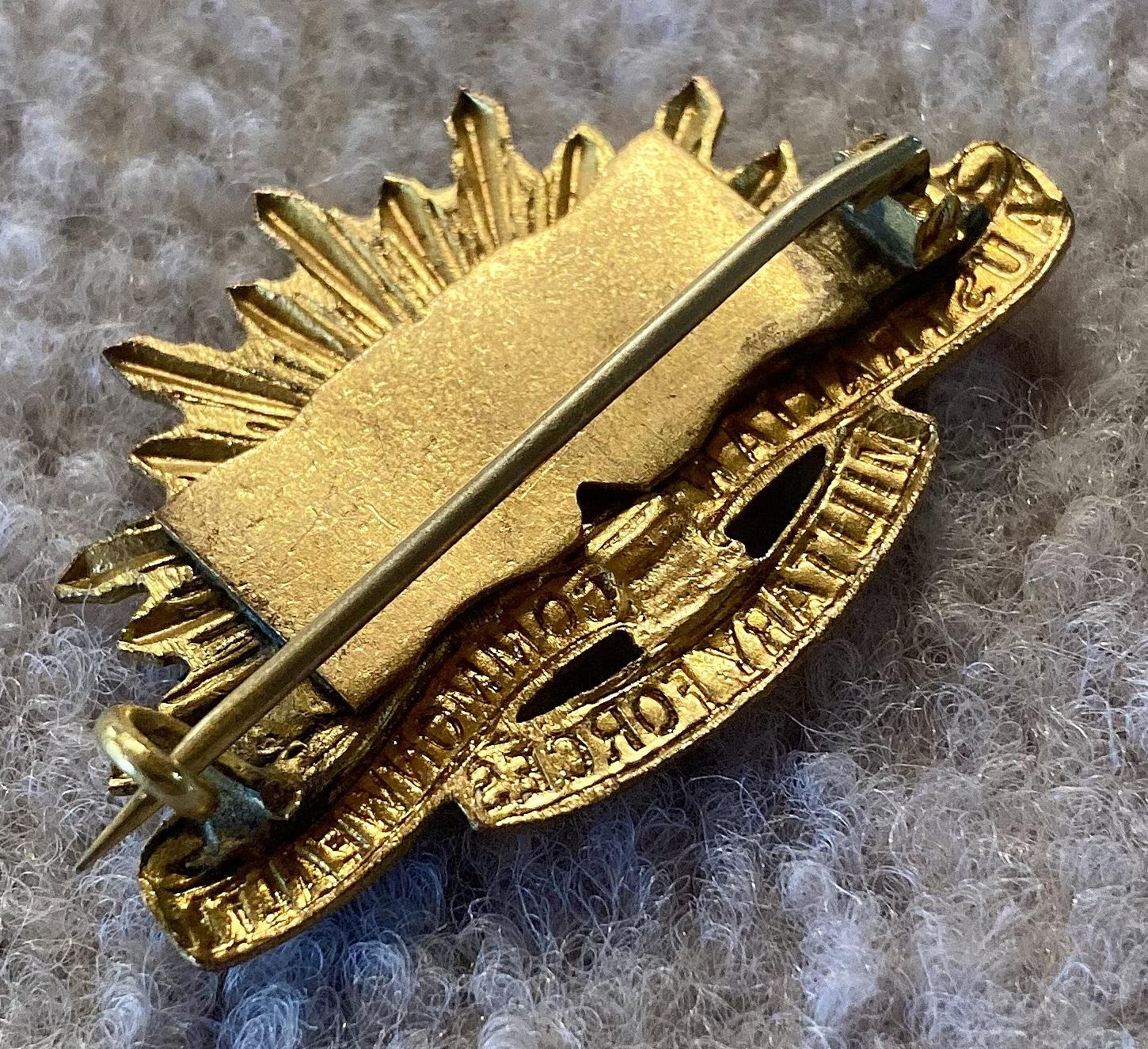 Oblique view of reverse of sweetheart brooch made from modified rising sun badge dated 1916