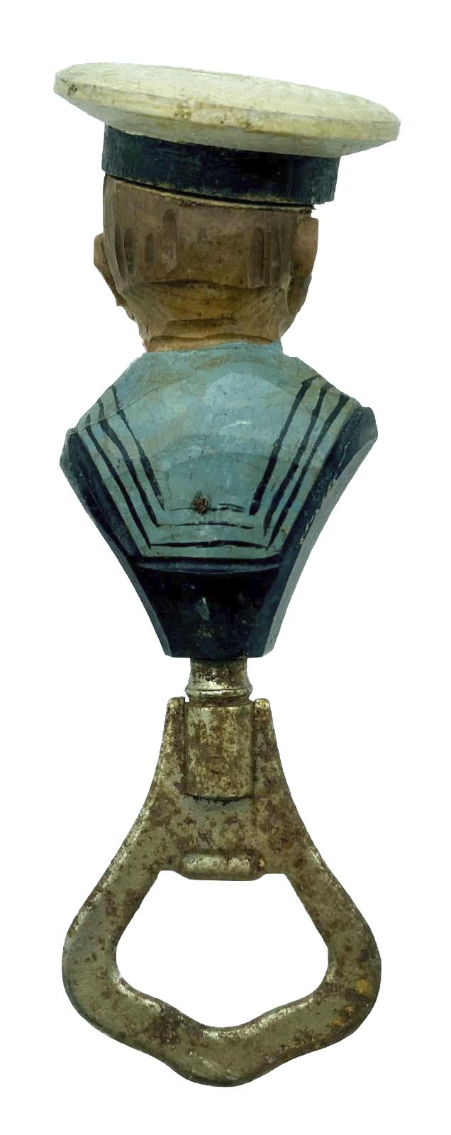 Back view of carved sailor barware item - bottle opener