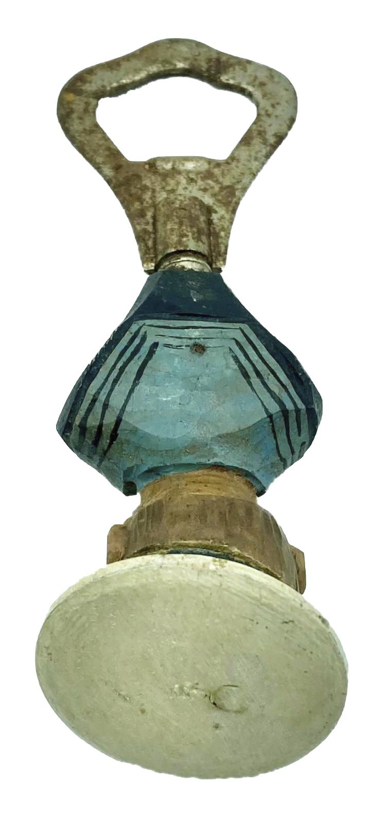 Top view of carved sailor barware item - bottle opener