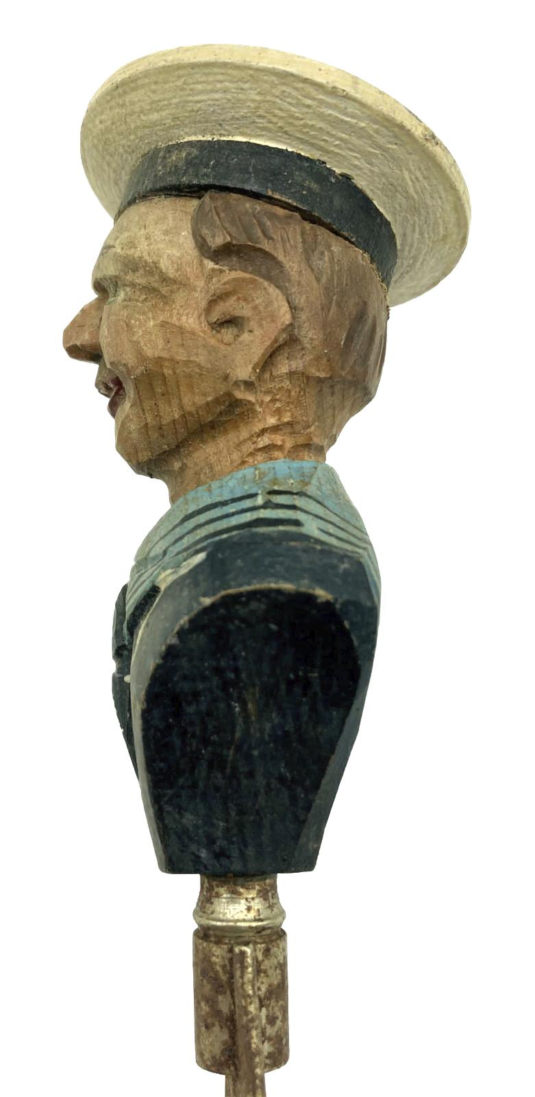 Other side view of carved sailor barware item - bottle opener