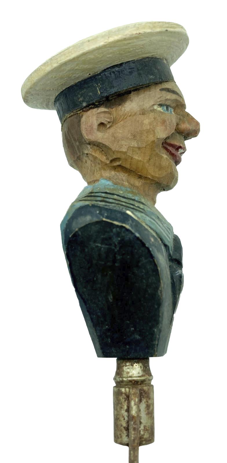 Side view of carved sailor barware item - bottle opener