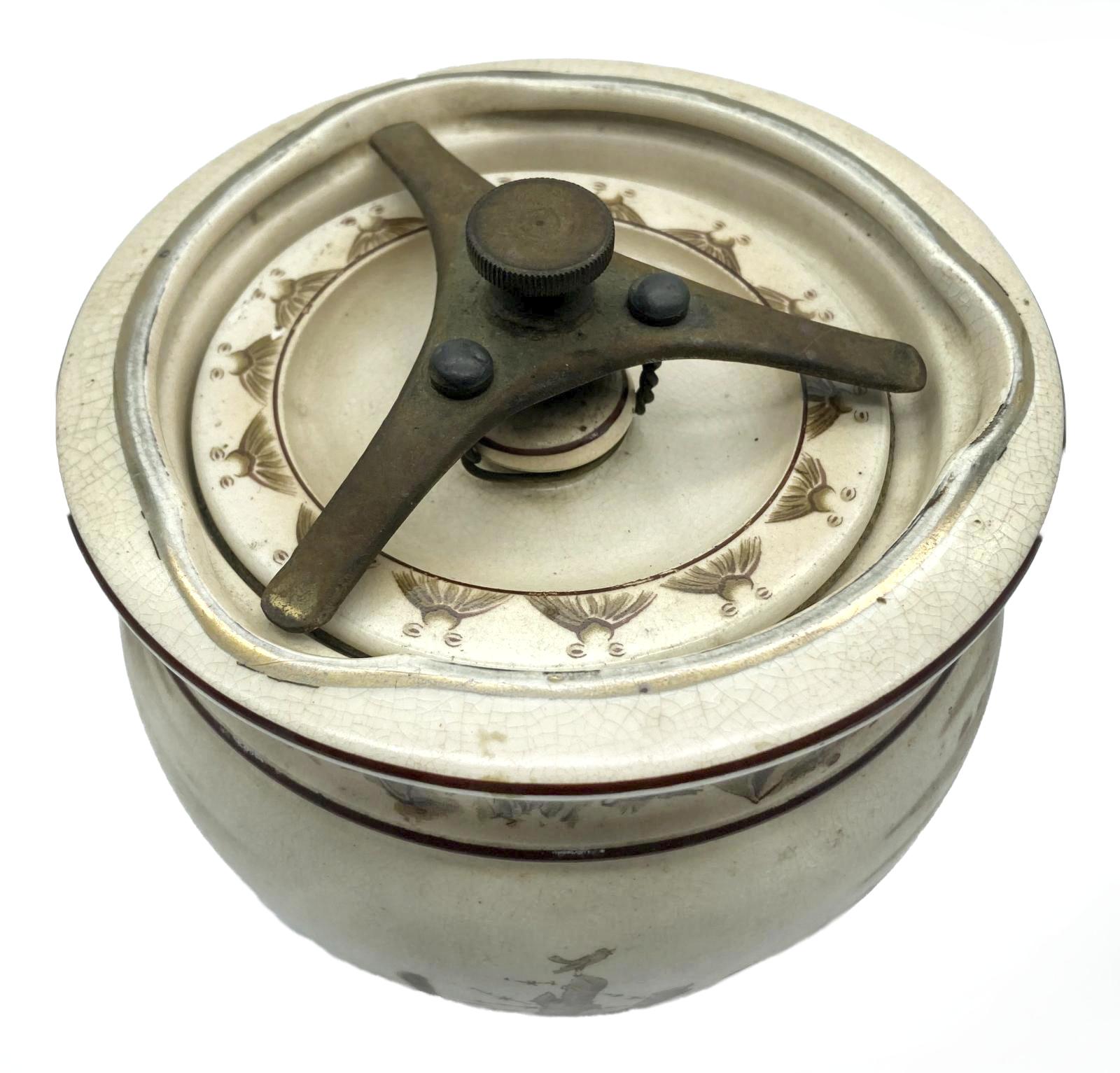 WWI era tobacco jar featuring Bruce Bairnsfather cartoon - top view