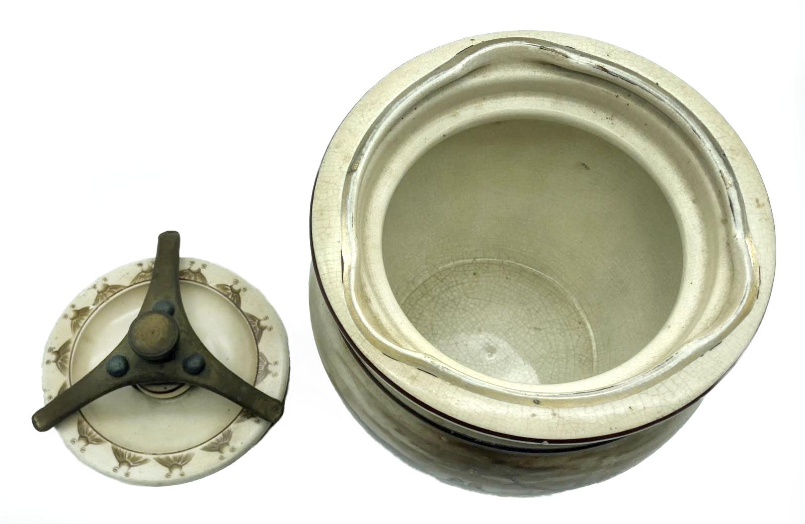 WWI era tobacco jar featuring Bruce Bairnsfather cartoon - top view with lid off