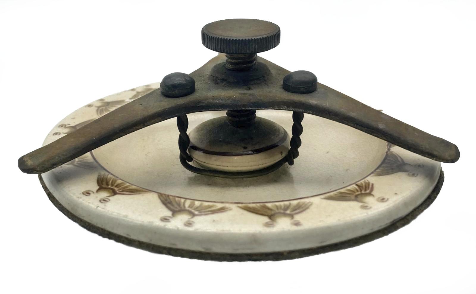 WWI era tobacco jar featuring Bruce Bairnsfather cartoon - side view of lid