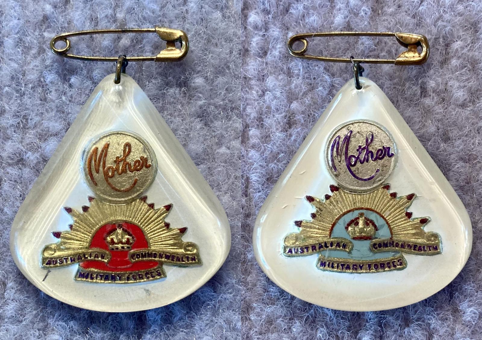 Perspex sweetheart brooches depicting rising sun badges -  blue and red