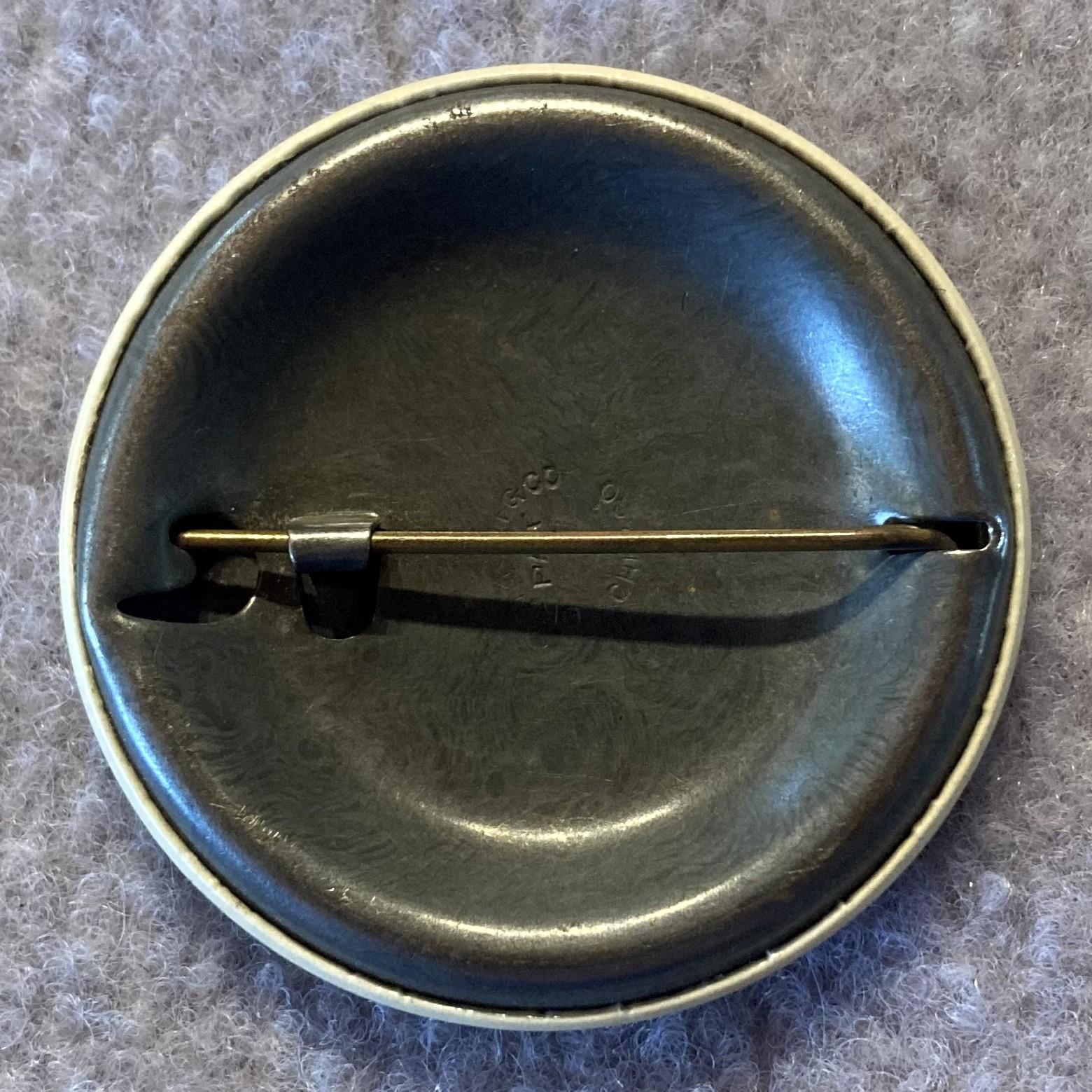 Reverse of Cheer-Up Society Warden's badge