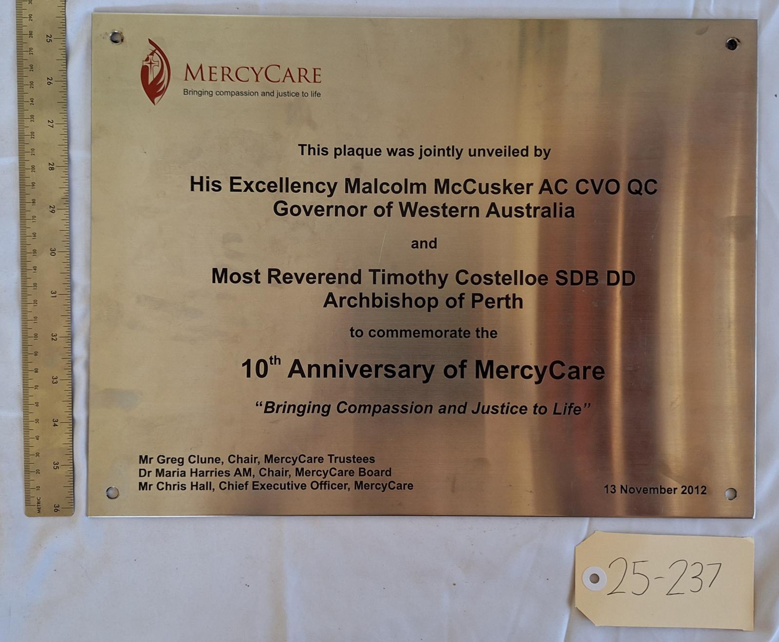 25-237 Metal Plaque Commemorating 10th Anniversary of MercyCare image with background, scale and tag