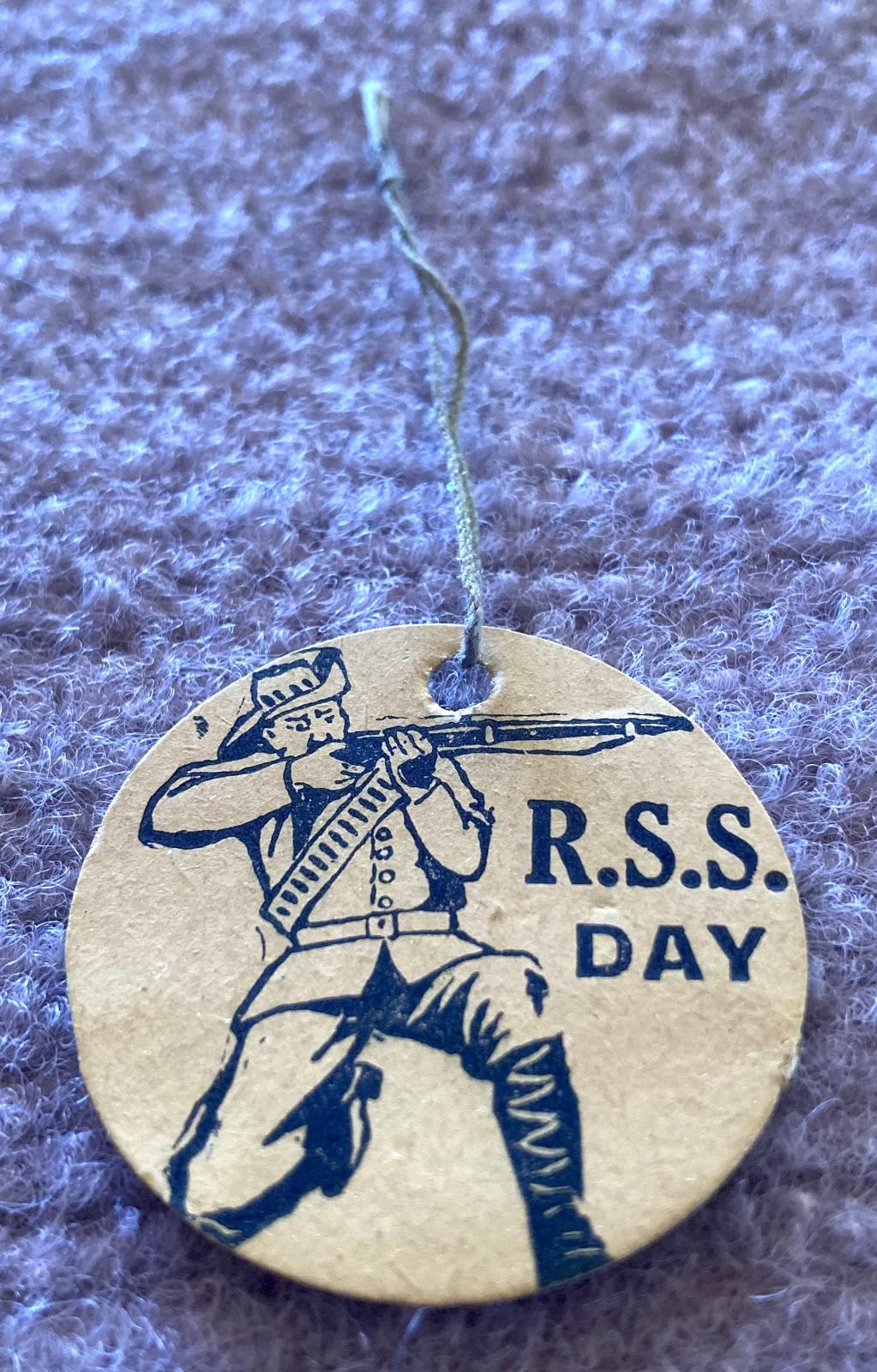Angled view of WWI fundraising tag - R.S.S. Day