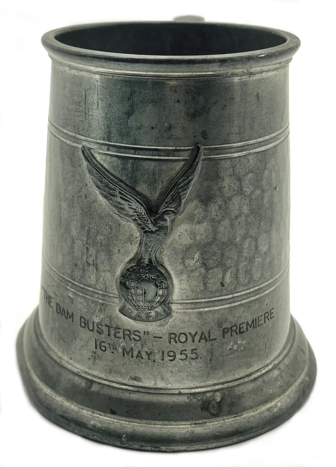 Metal tankard showing motif and inscription