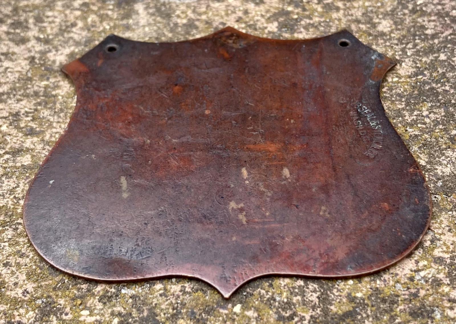 Angled view of reverse of memorial plaque commemorating American nurse Jane Delano