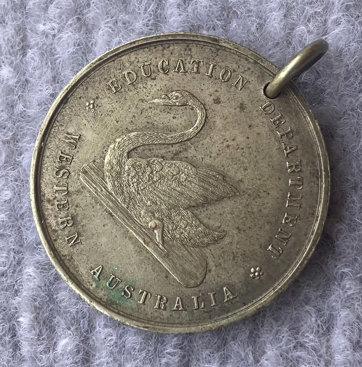 Other oblique view of one side of Education Department of WA medallion 