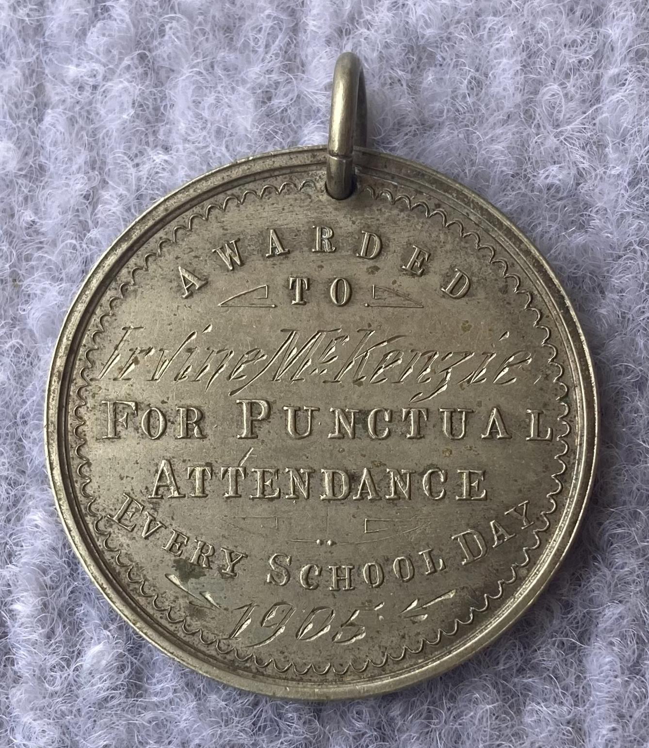 Engraved side of Education Department of WA medallion awarded to Irvine McKenzie