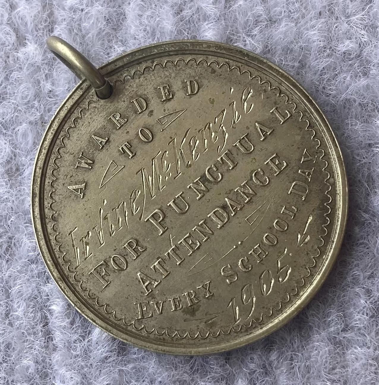 Oblique view of engraved side of Education Department of WA medallion