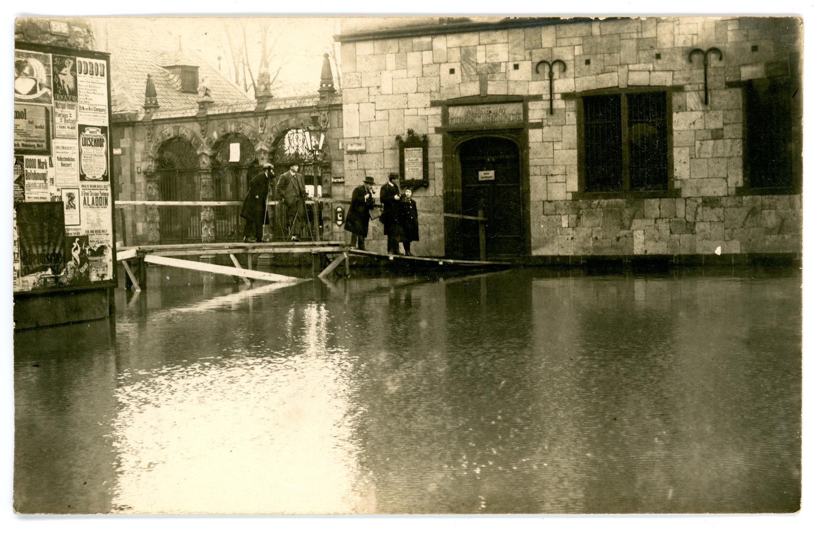 Four men and a child standing outside the Berlin Museum of Natural History, "Museum fur Naturkunde".