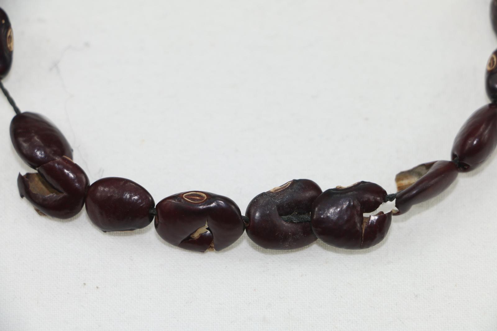 Close up of seed necklace.