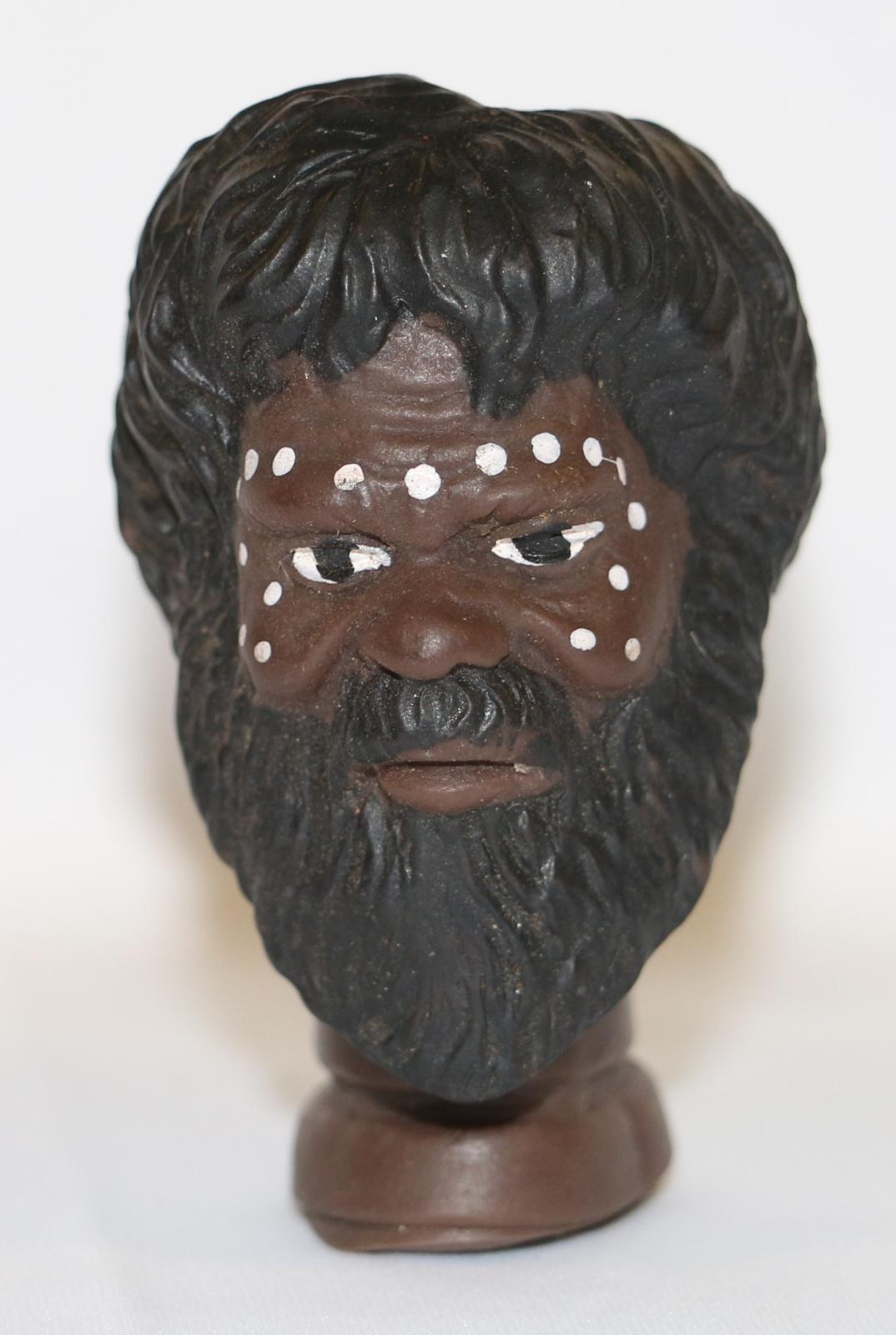 Doll's head, Aboriginal adult male, dark hair and beard with painted white dots on face "number 99". Yagan or Midgegooroo.