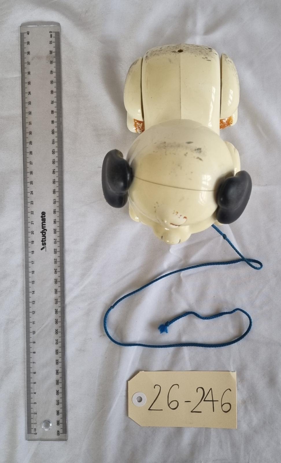 26-246 Pulling toy dog photo with background, scale and tag.