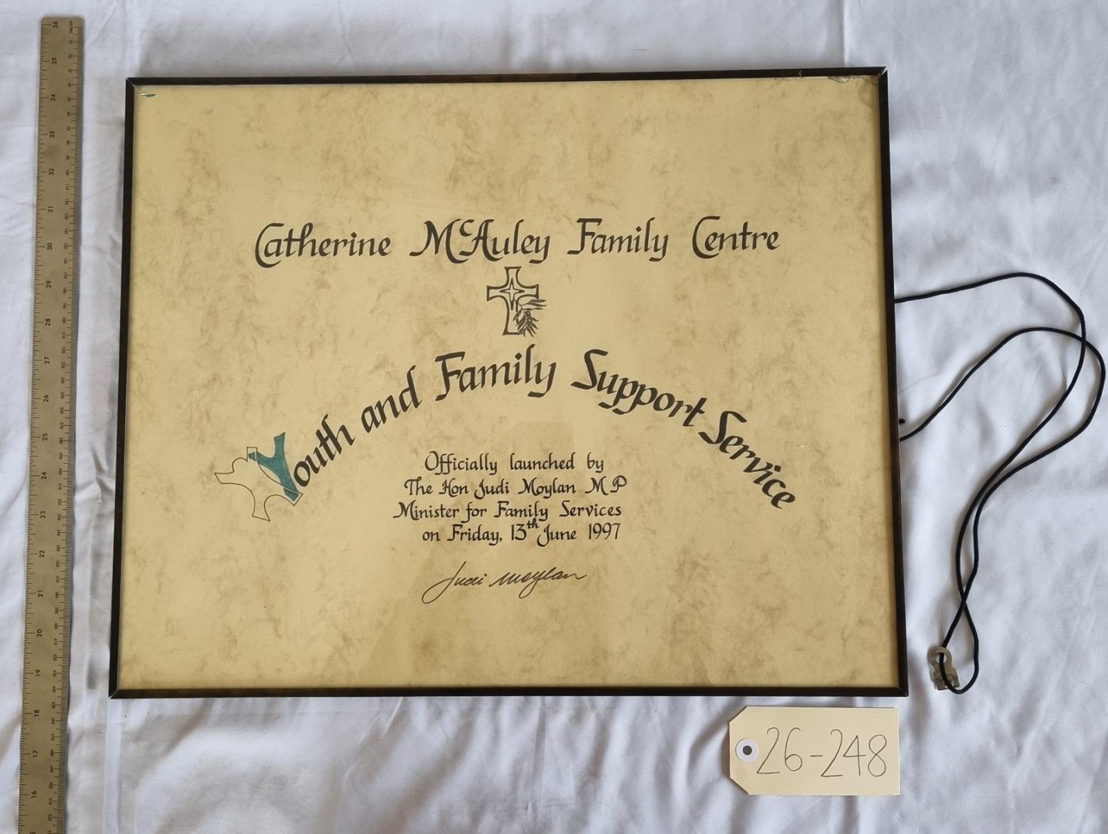 26-248 Catherine McAuley Family Centre - Youth and Family Support Services Signage photo with background, scale and tag.