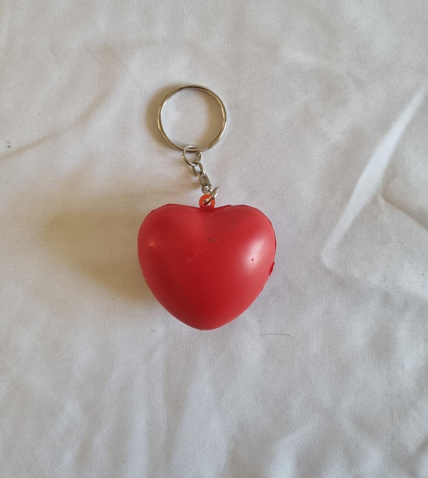 26-251.1 Heart Keychain with MercyCare Old Logo photo with background back-view.