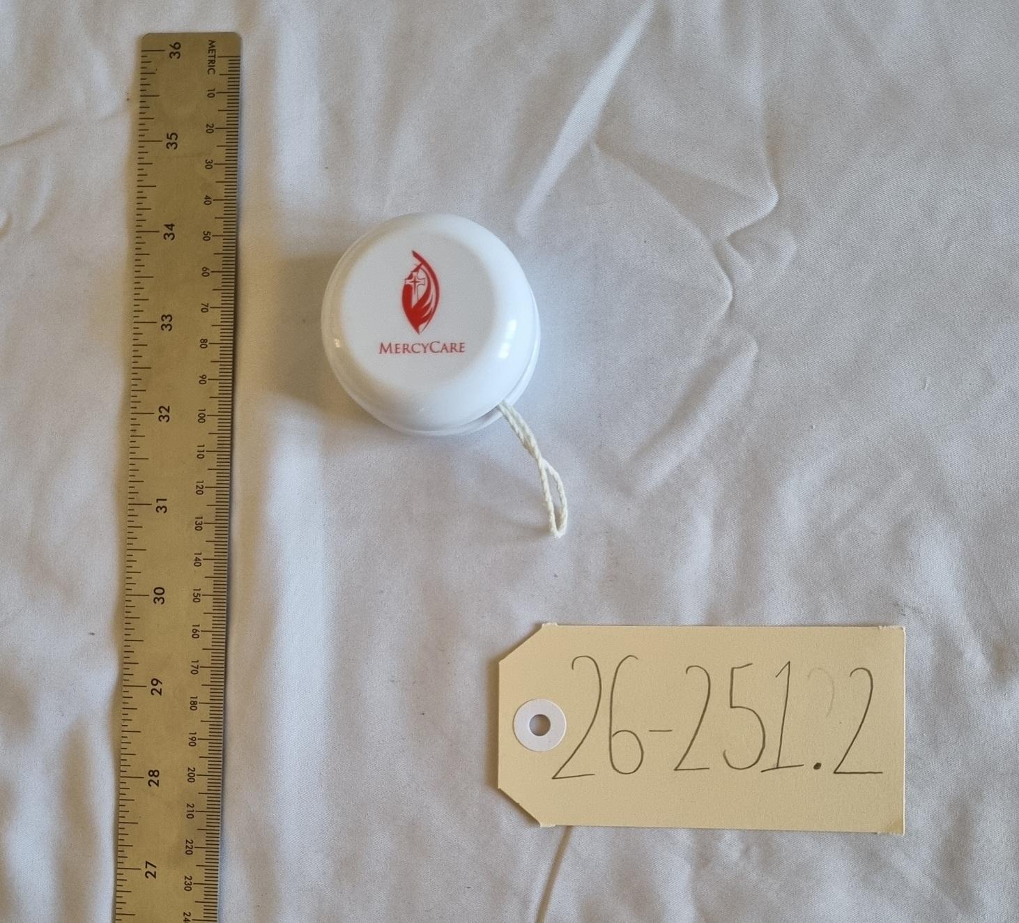 26-251.2 Yoyo with MercyCare Old Logo photo with scale and tag.