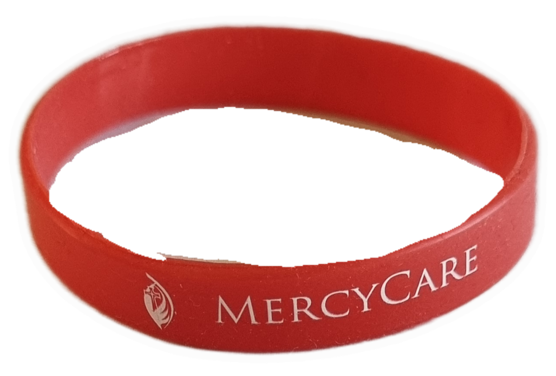 26-251.6 Red Wristband with old MercyCare logo photo without background. 