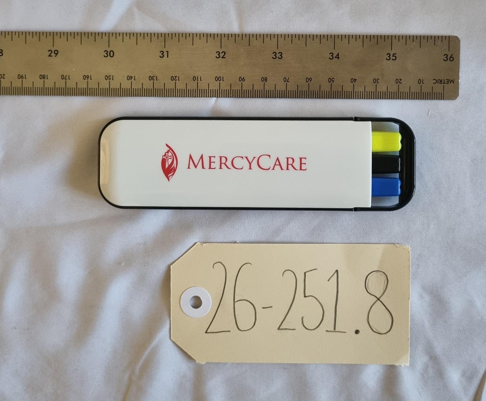 26-251.8 Three pack of stationery with MercyCare Old Logo photo with scale and tag.