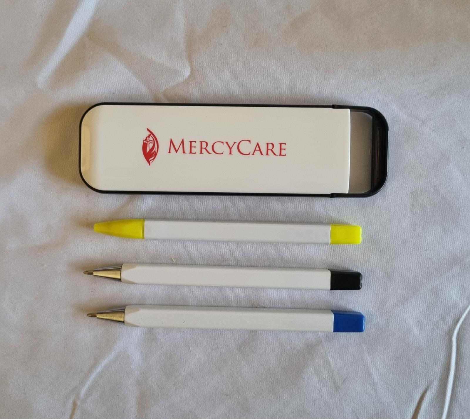26-251.8 Three pack of stationery with MercyCare Old Logo photo with background.