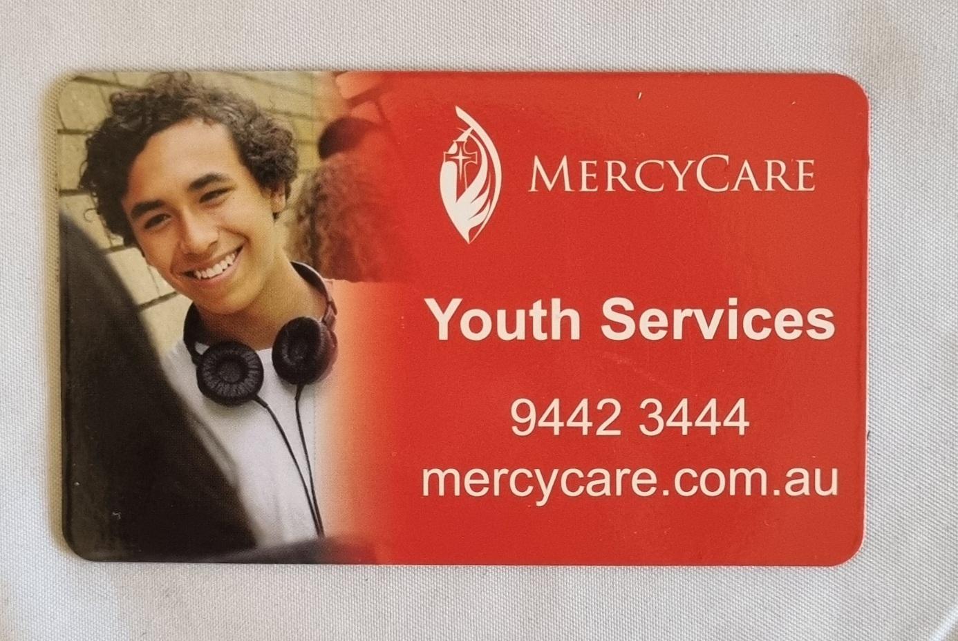 26-251.12 MercyCare Business Card photo with background front-view.