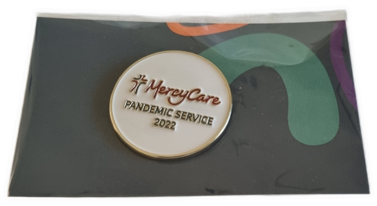 26-254 MercyCare Pandemic Service Badge photo without background. 