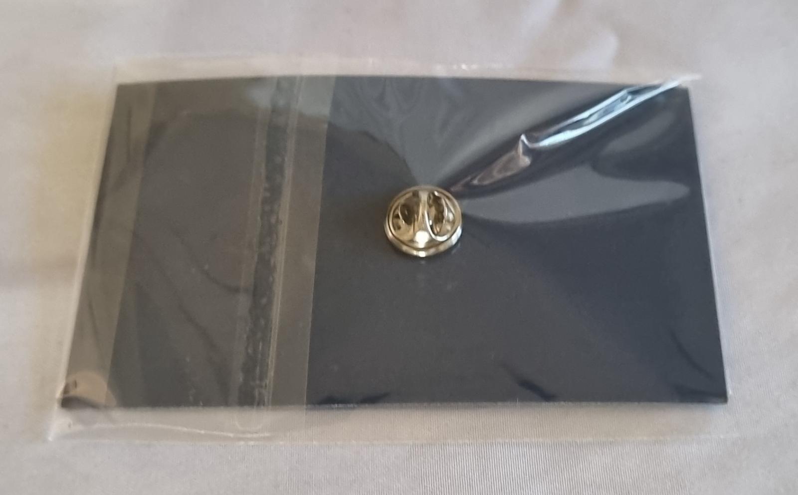 26-254 MercyCare Pandemic Service Badge photo with background back-view.