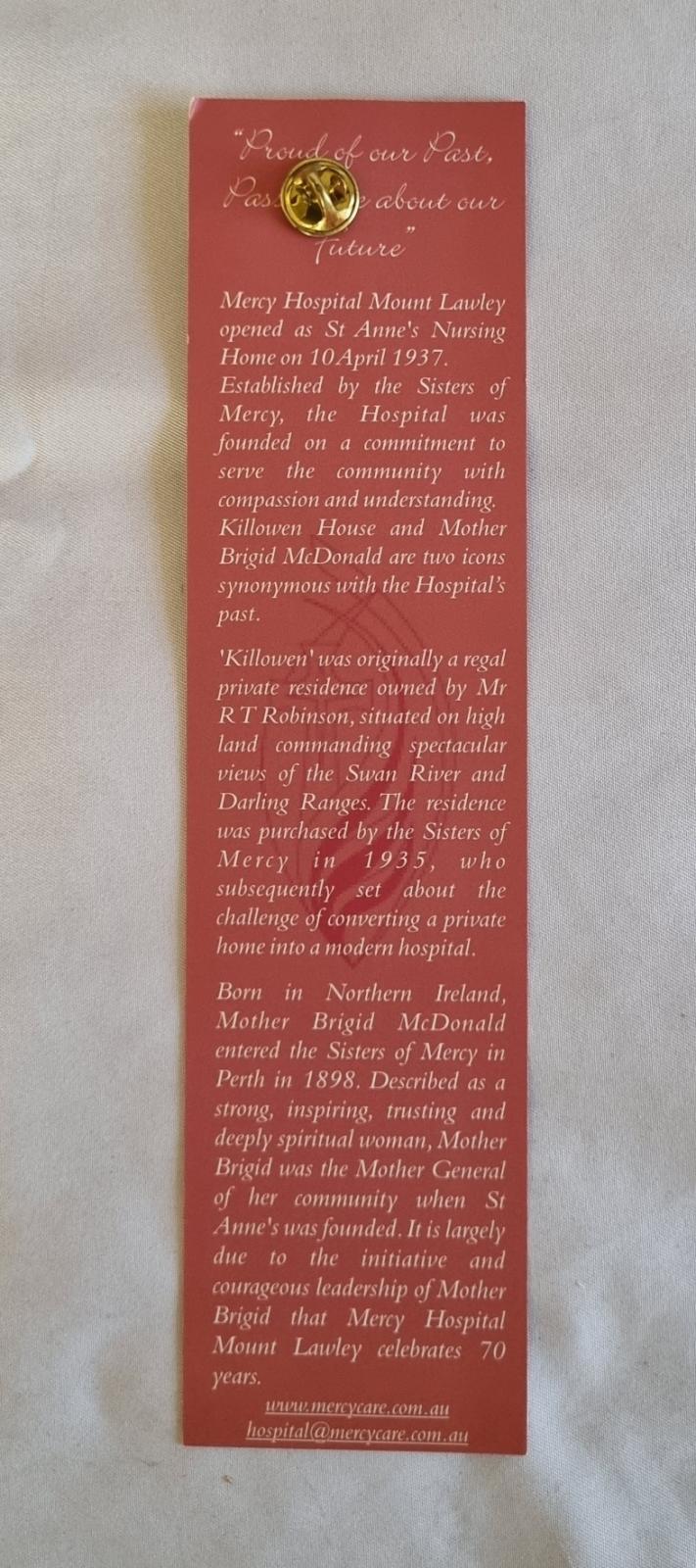 26-255 Mercy Hospital Mount Lawley 70th anniversary badge photo with background back-view.