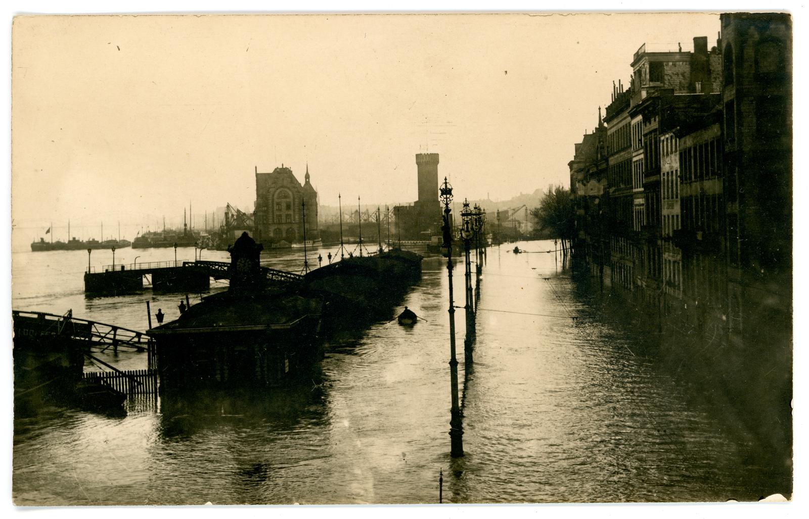 Photographic postcard showing flooding in Cologne, Germany.