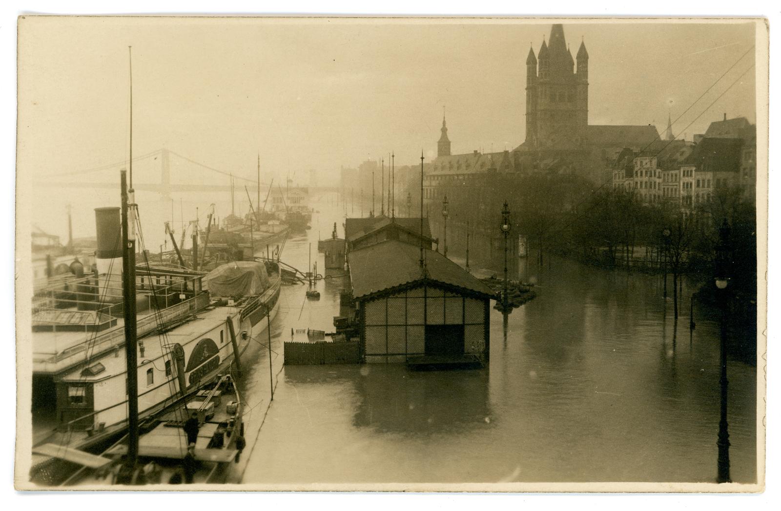 Photographic postcard showing floods in Cologne, Germany.