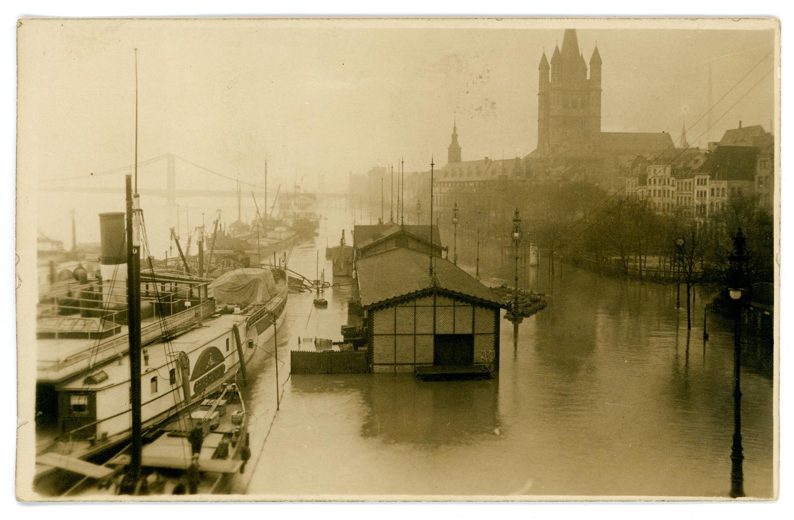 Photographic postcard showing floods in Cologne, Germany.