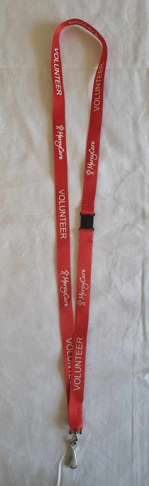 26-257 Lanyard with new MercyCare logo photo with background. 