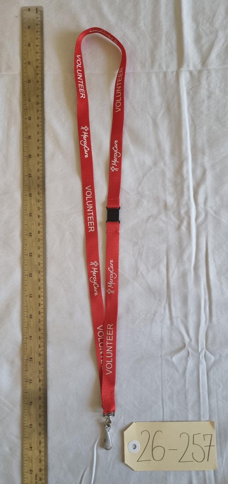 26-257 Lanyard with new MercyCare logo photo with scale and tag.