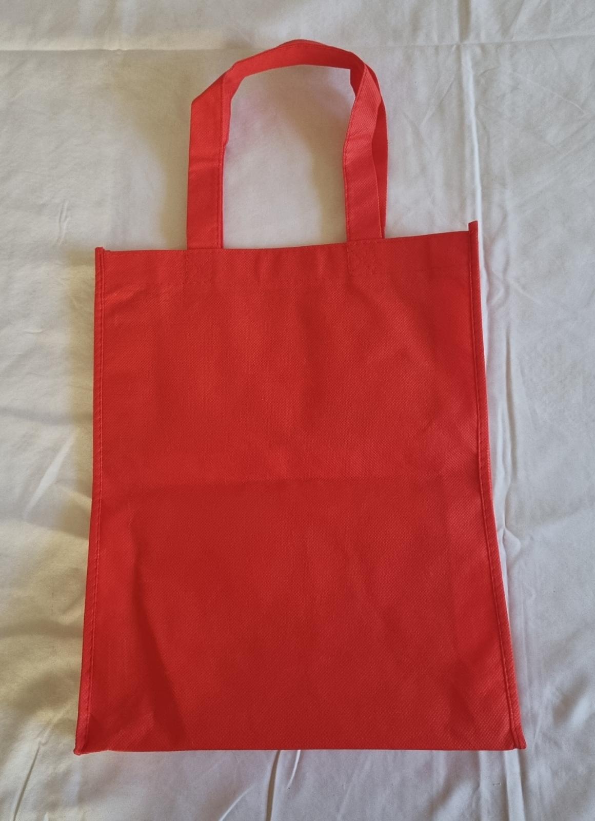 26-259 Red MercyCare bag with the new MercyCare logo photo with background back-view.