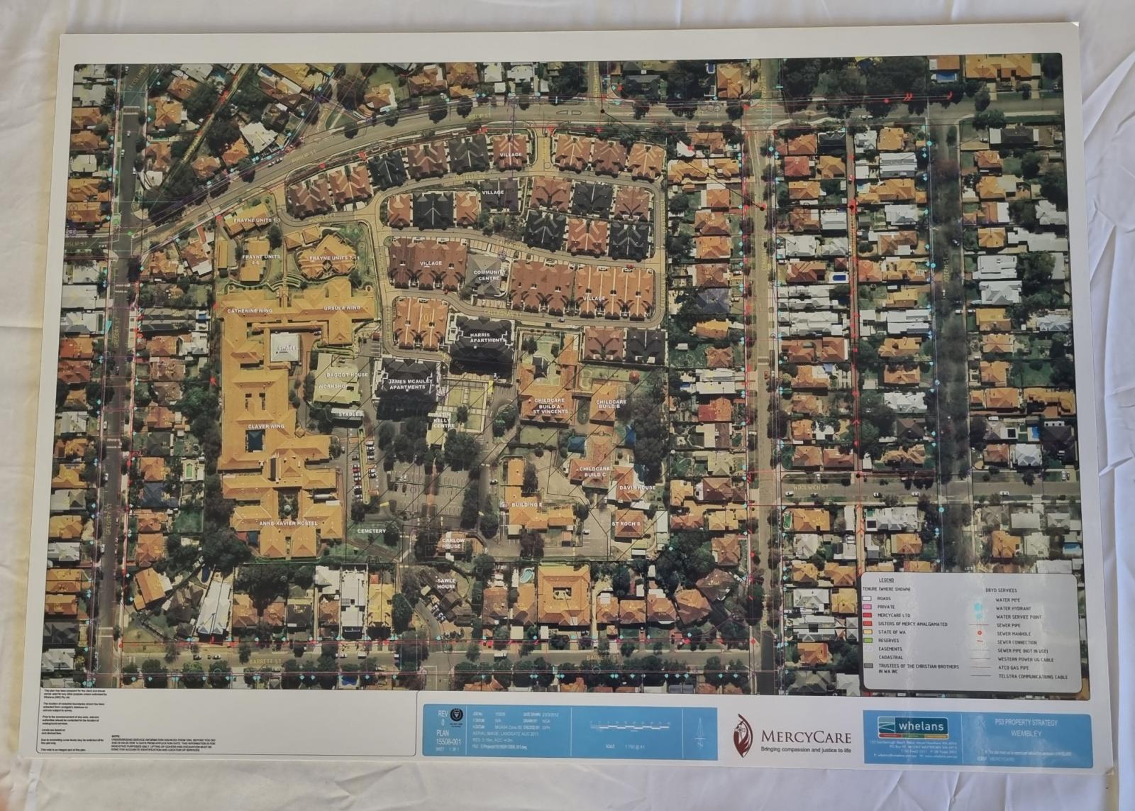 26-261.1 Aerial view/plan of the MercyCare Wembley Campus photo with background front-view.